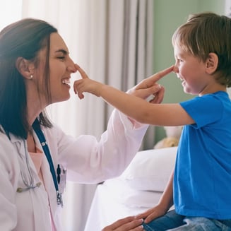 Pediatrician and patient in office